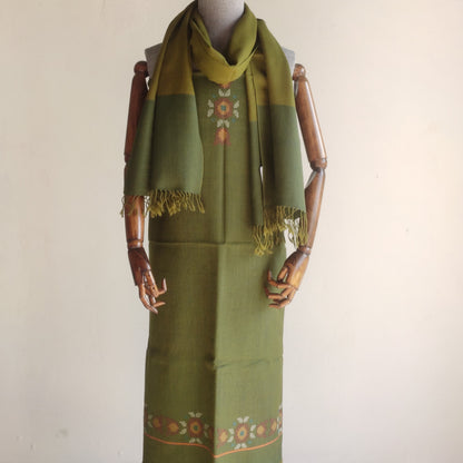Green women's woolen suitwith matching stole on a mannequin 
