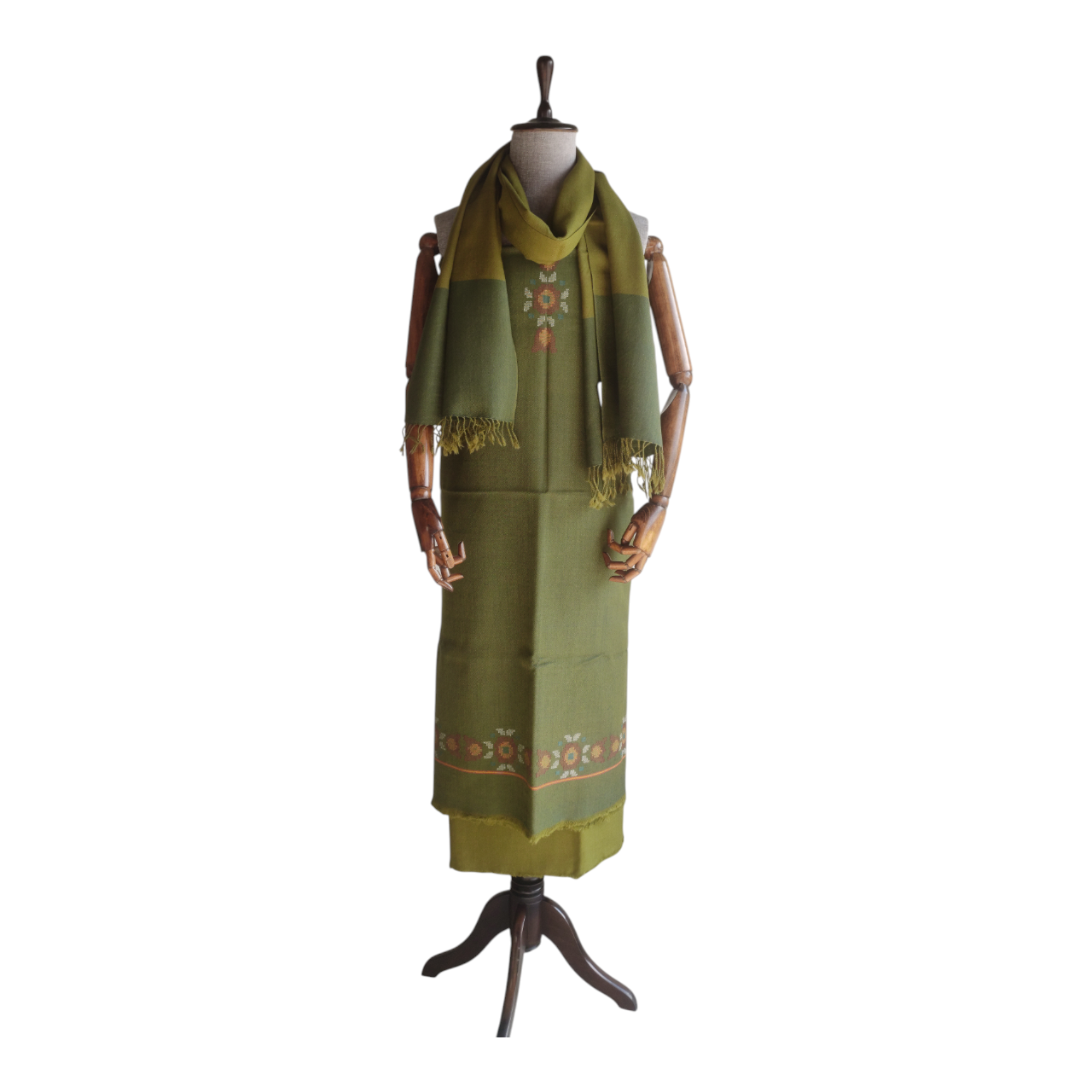 Green women's woolen suit with a matching stole on a mannequin 