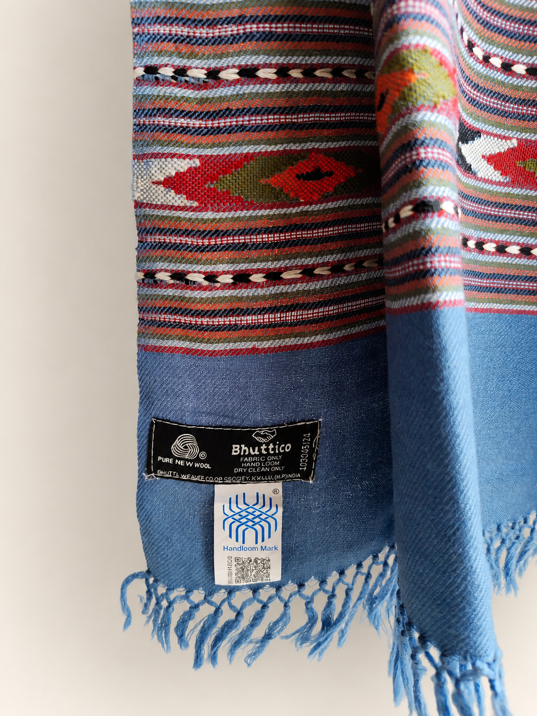 Handwoven Bhuttico Sky Heritage Kullu stole in pure merino wool, jeans blue - styled view