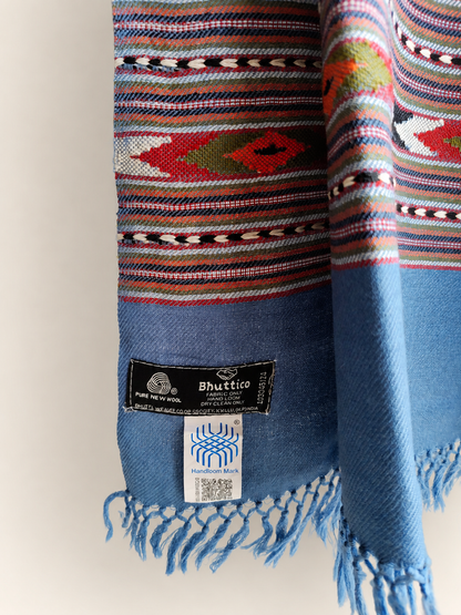 Handwoven Bhuttico Sky Heritage Kullu stole in pure merino wool, jeans blue - styled view