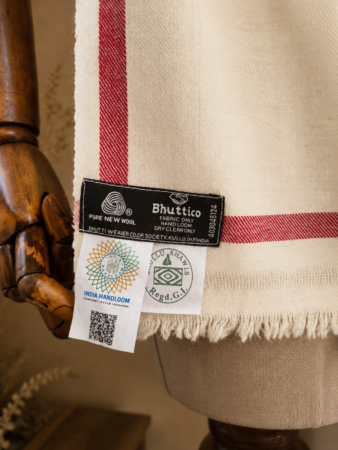 Handwoven Crimson Blossom medallion Kullu shawl in pure merino wool, white - folded view