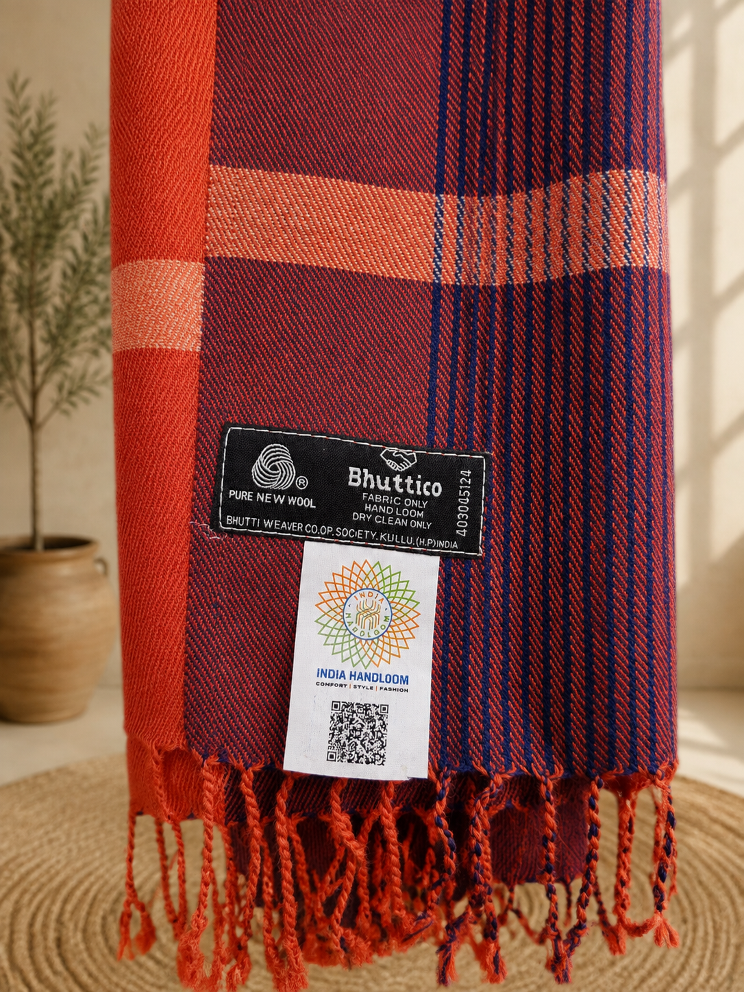 Handwoven pure merino wool Kullu stole in rust - styled view