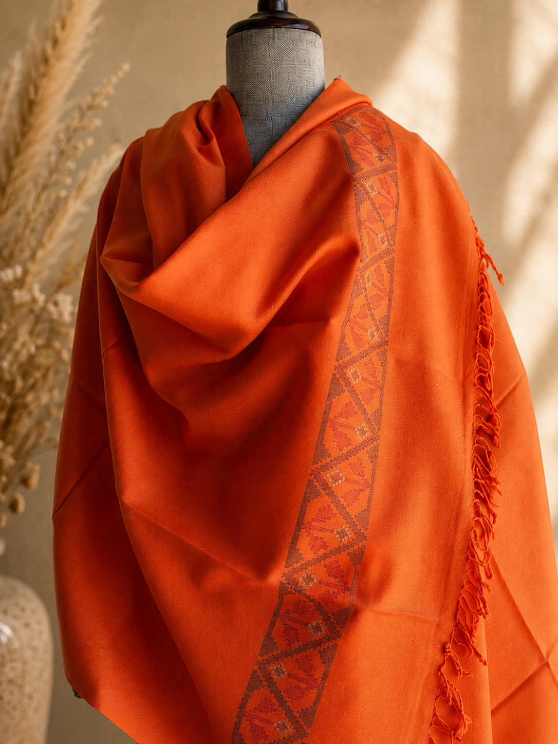 Handwoven Saffron Ember Kullu shawl in pure merino wool, orange - folded view