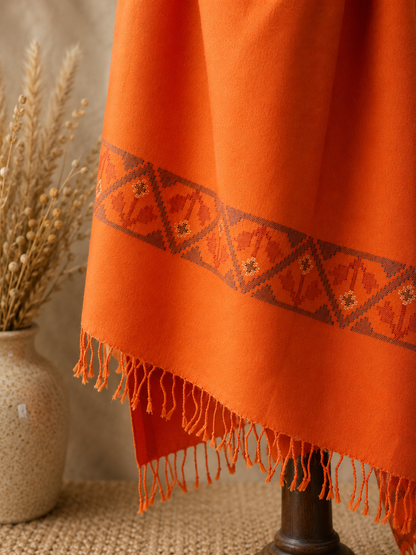 Handwoven Saffron Ember Kullu shawl in pure merino wool, orange - styled view