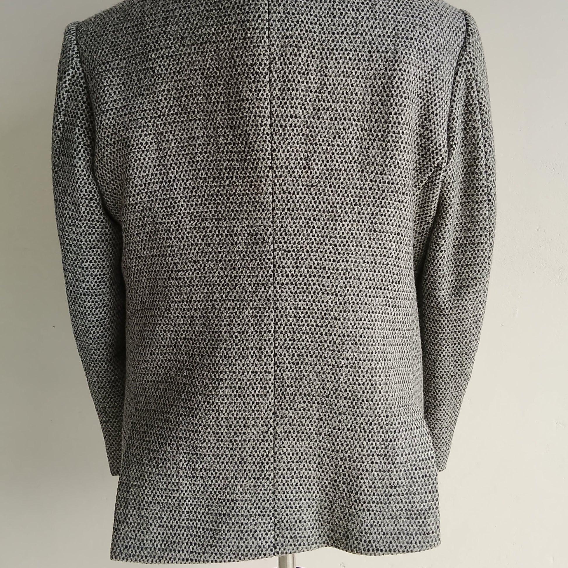 Men's handwoven black and white merino wool coat, honeycomb weave - close-up texture