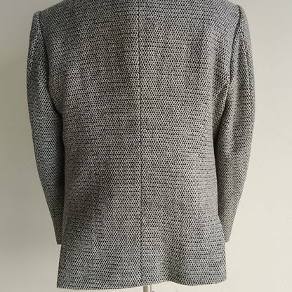 Men's handwoven black and white merino wool coat, honeycomb weave - close-up texture