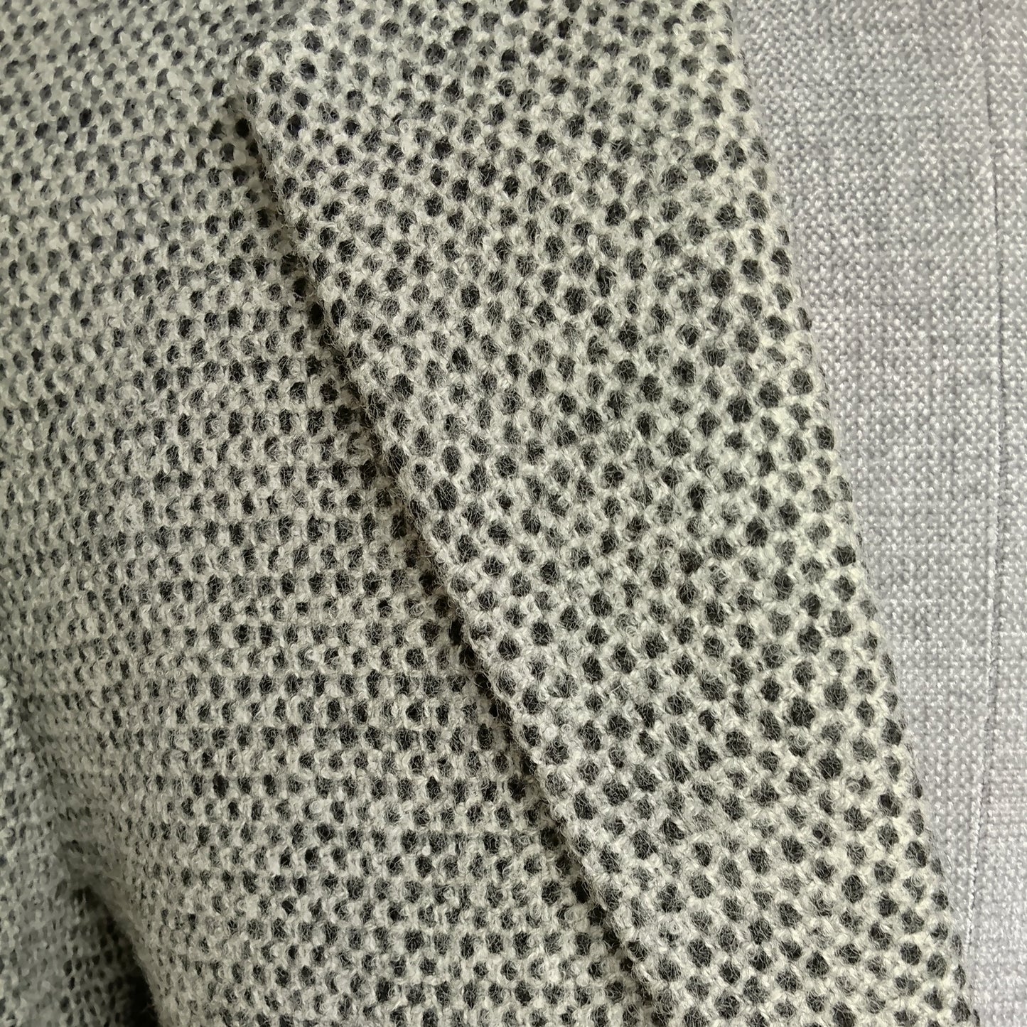 Men's handwoven black and white merino wool coat, honeycomb weave - styled view