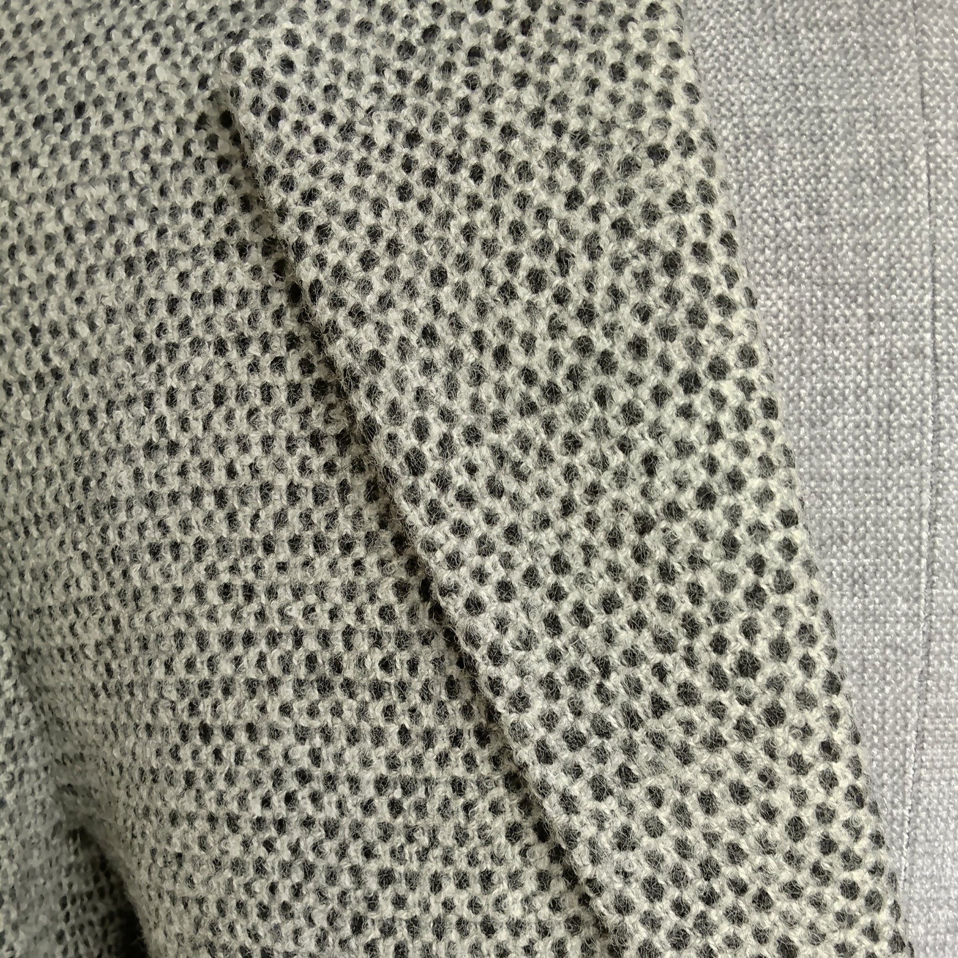 Men's handwoven black and white merino wool coat, honeycomb weave - styled view
