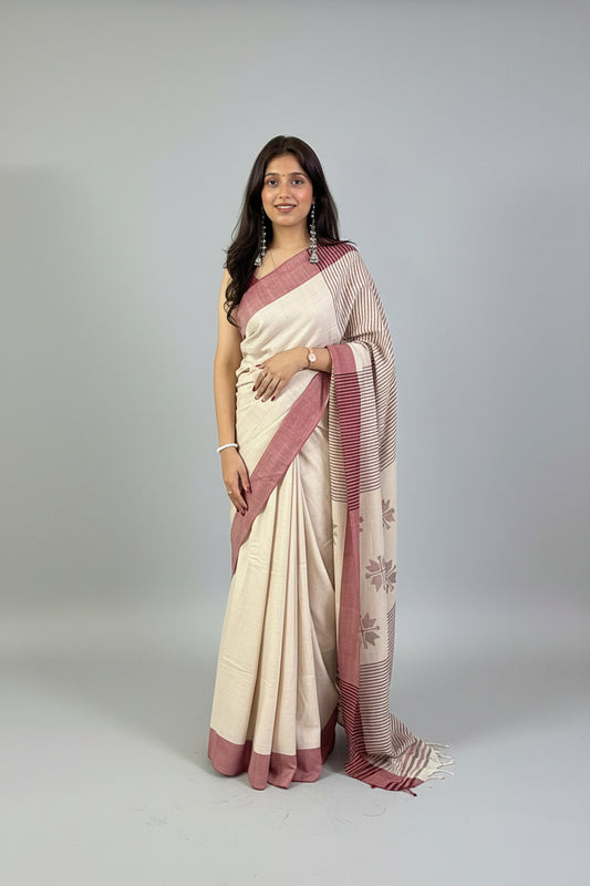 Woman wearing a cream handwoven merino wool saree, styled with a matching blouse
